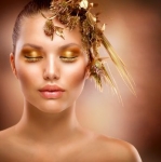 Golden Makeup. Luxury Fashion Girl Portrait